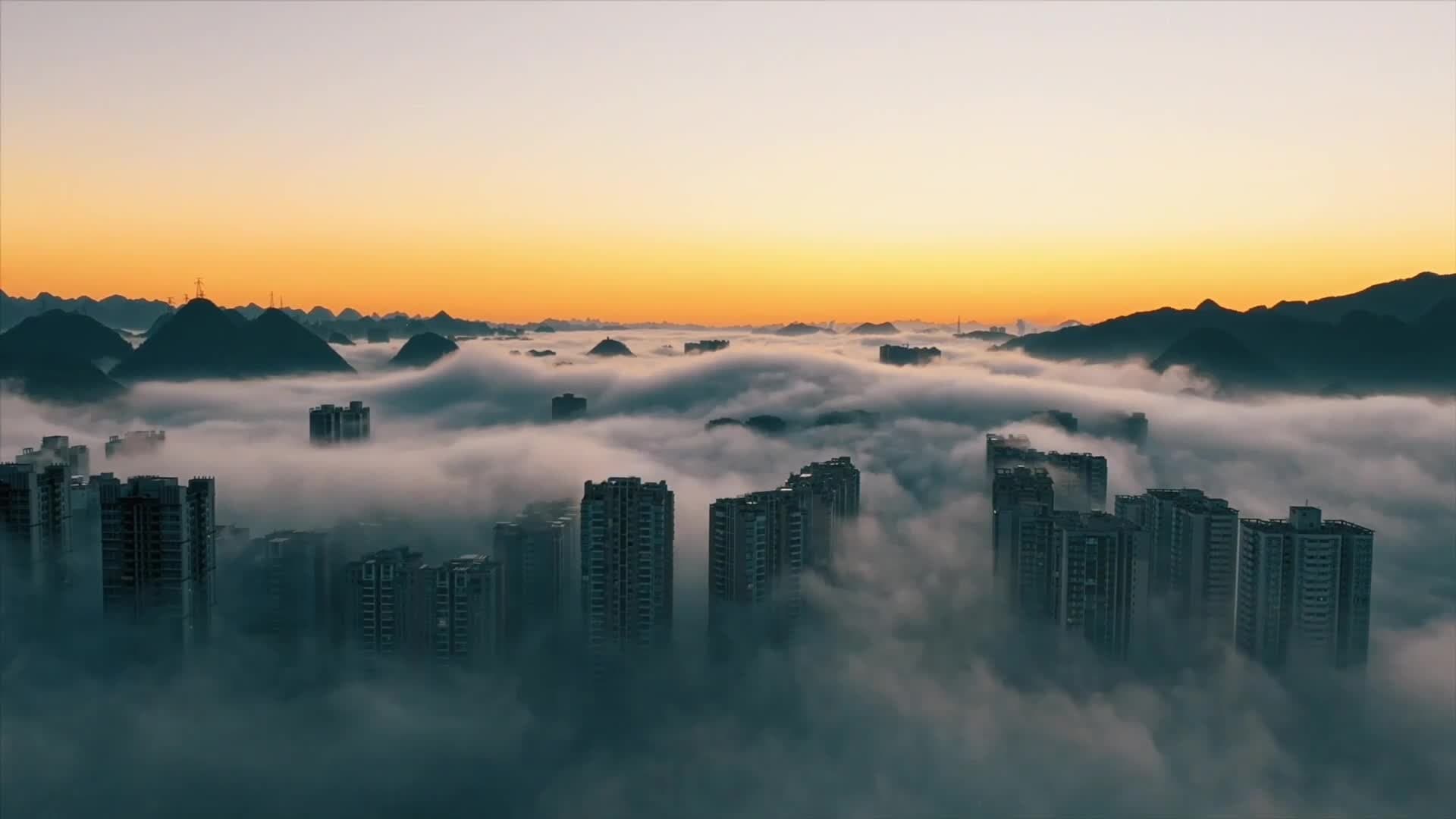 เกลียวคลื่นทะเลหมอกคลุมหมู่ตึก-ภูเขา งดงามเหนือจริงในกุ้ยโจว